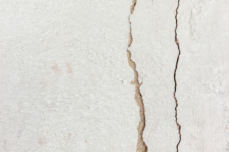 Long crack running through a white painted wall